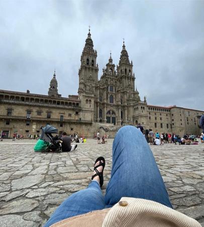 Student relaxing in front of large chapel in Florence Italy